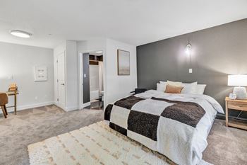 a bedroom with a bed and a rug at The Meriden, Meriden